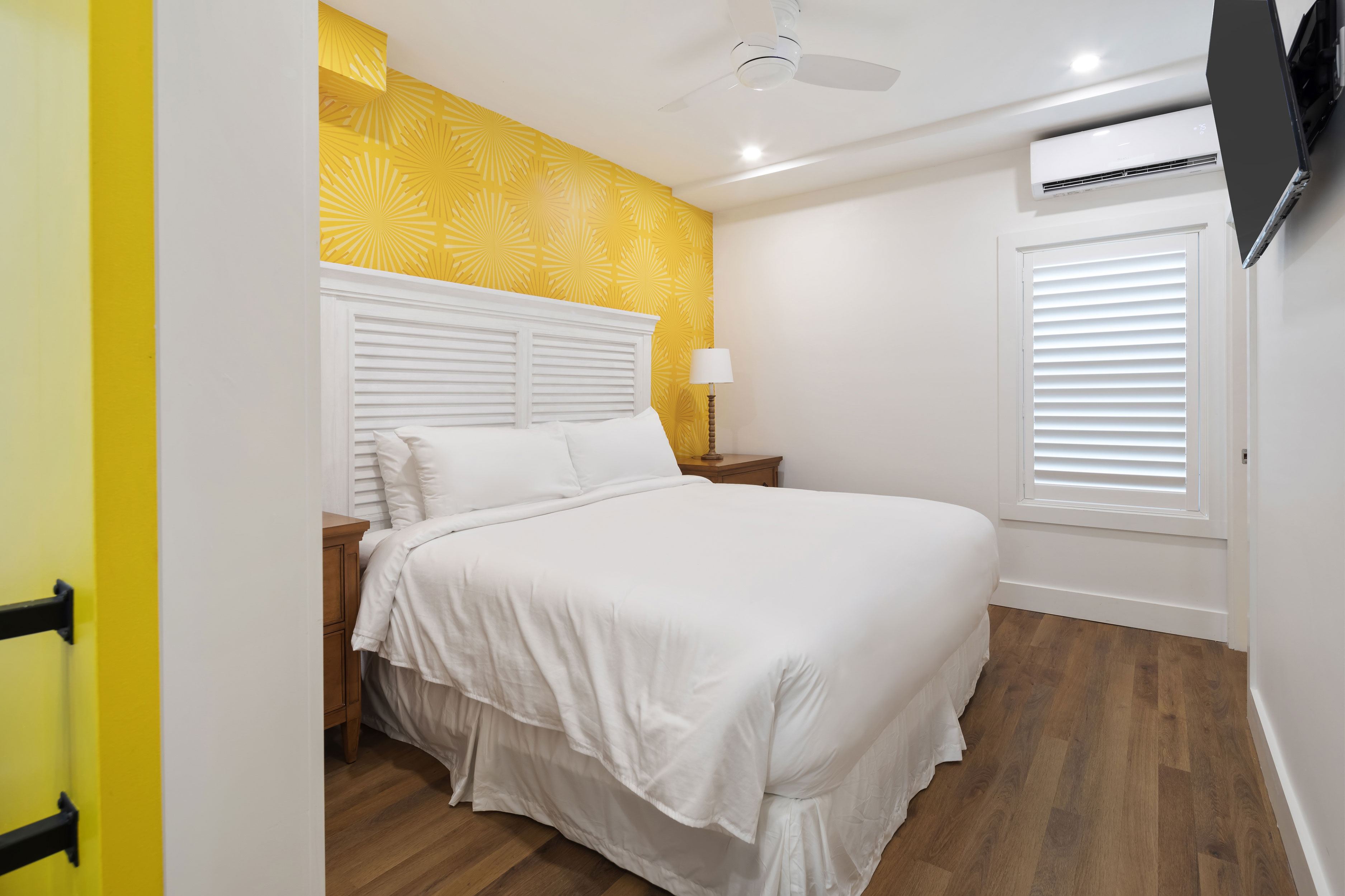Image of hotel room with yellow accents